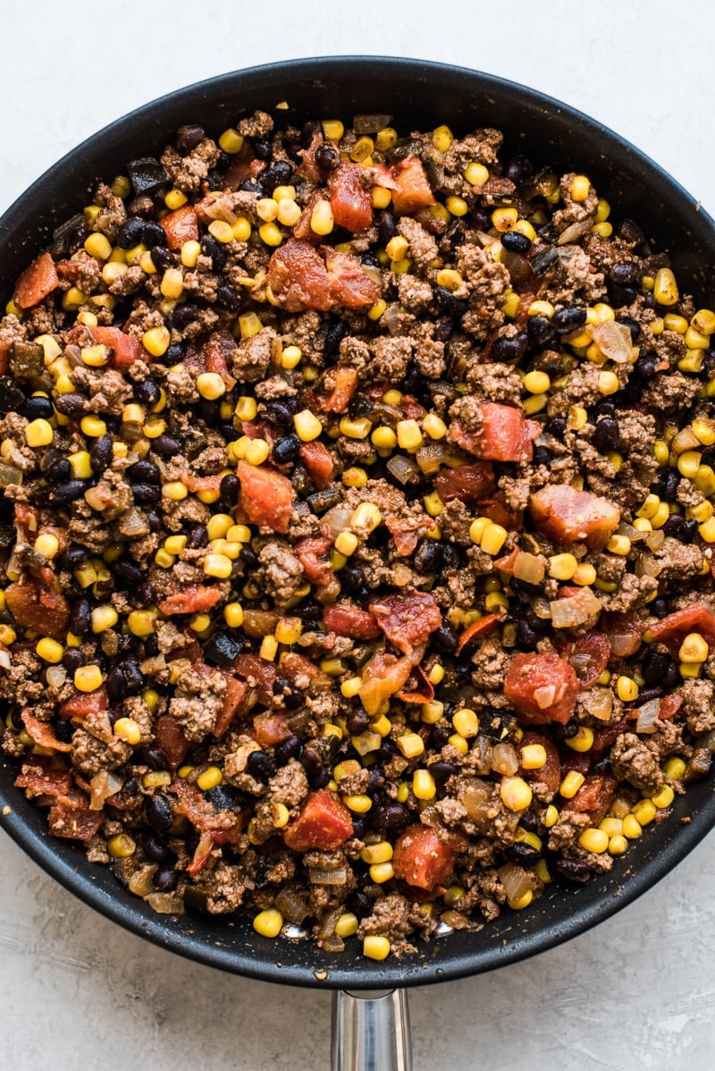 This Easy Taco Casserole (also known as Taco Lasagna) is made with 3 layers of corn tortillas, ground beef, corn, black beans, the best taco seasoning and lots of melted cheese!