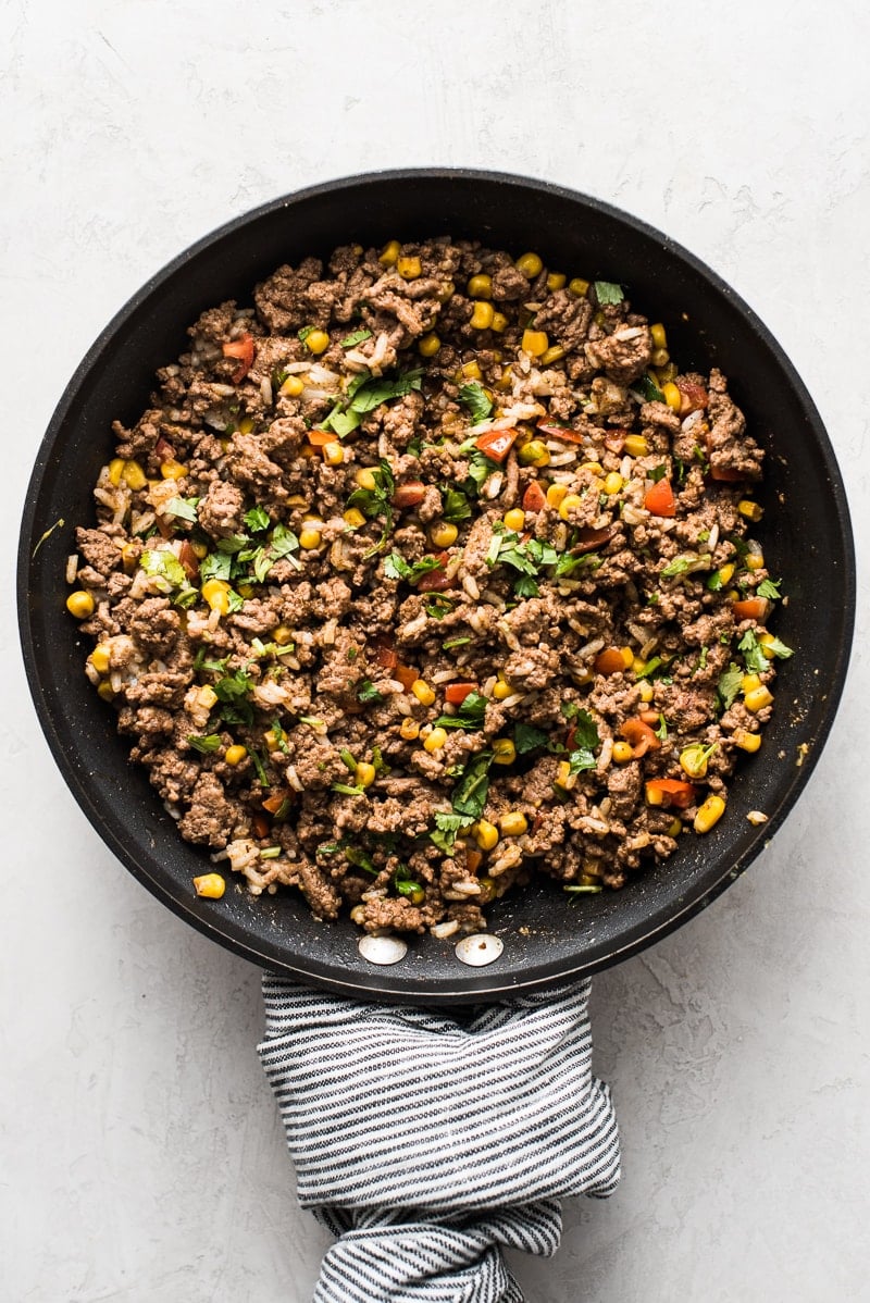 This stuffed bell peppers recipe is filled with ground beef, chicken or turkey and seasoned with an easy taco seasoning perfect for weeknight meals!