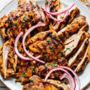 Grilled and sliced copycat chipotle chicken on a plate.