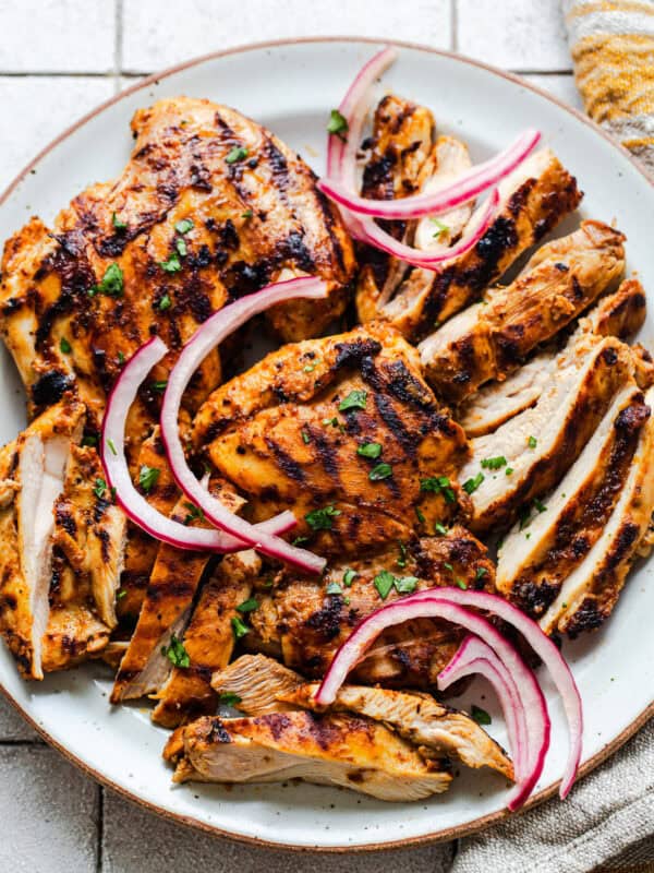 Grilled and sliced copycat chipotle chicken on a plate.