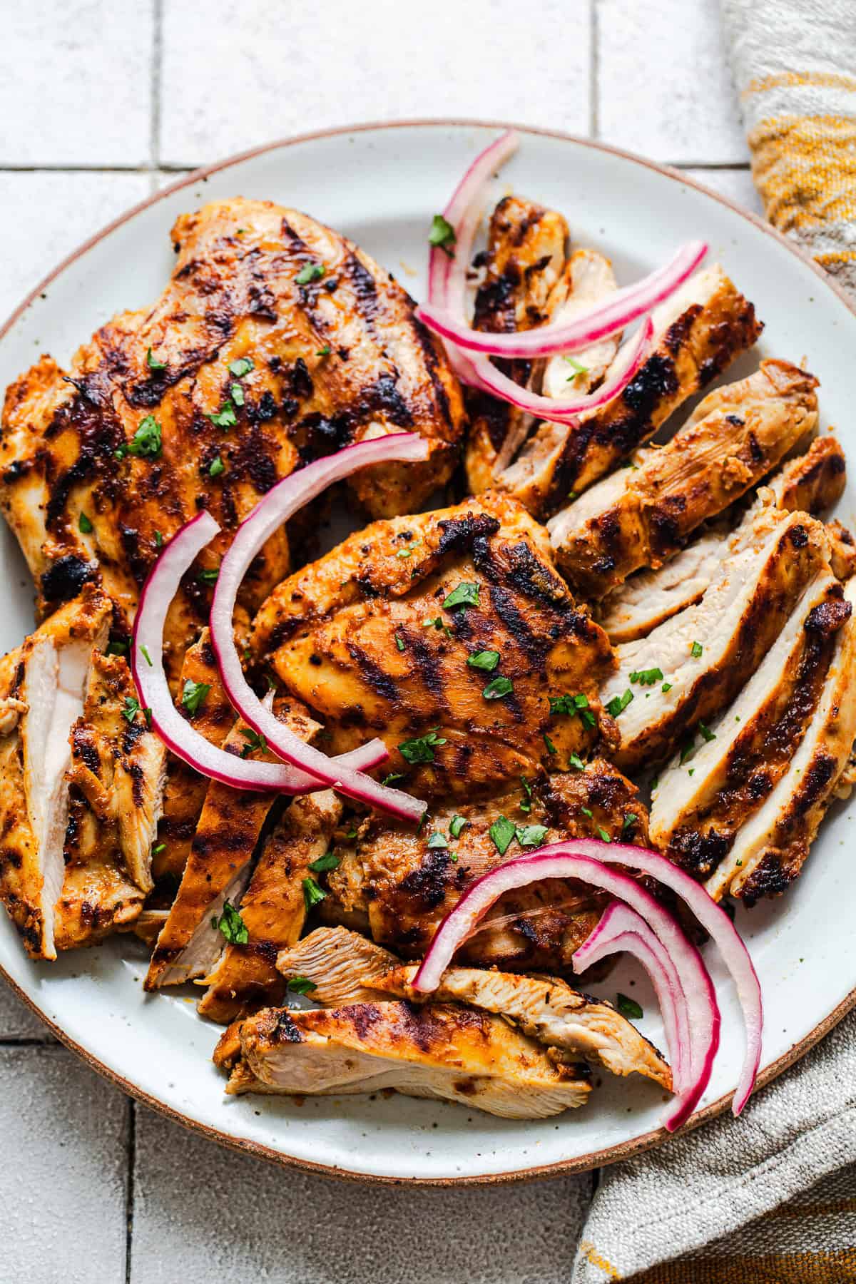Grilled and sliced copycat chipotle chicken on a plate.