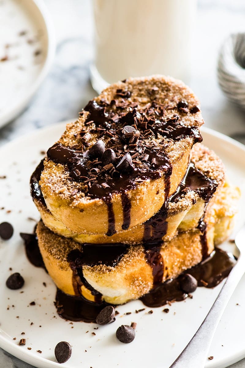 Thick cut slices of french toast coated with cinnamon sugar and topped with Mexican chocolate sauce.