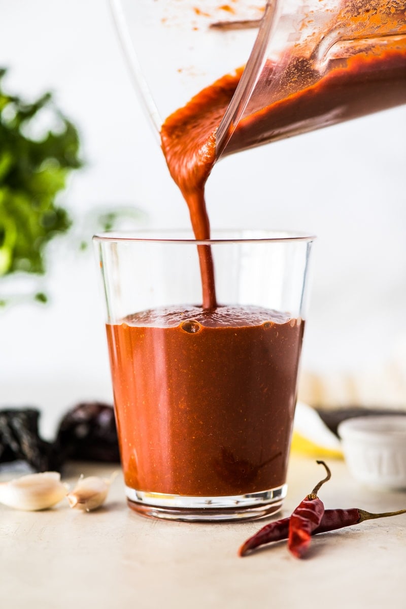 Made with dried chiles and a piece of Mexican chocolate, this Authentic Red Enchilada Sauce recipe is perfect in many dishes including enchiladas!