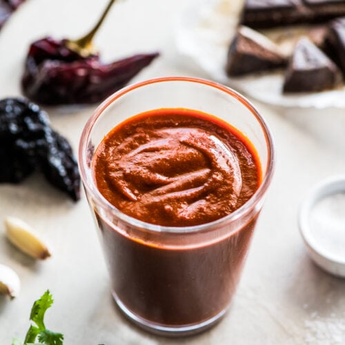 Made with dried chiles and a piece of Mexican chocolate, this Authentic Enchilada Sauce recipe is perfect in many dishes including enchiladas!