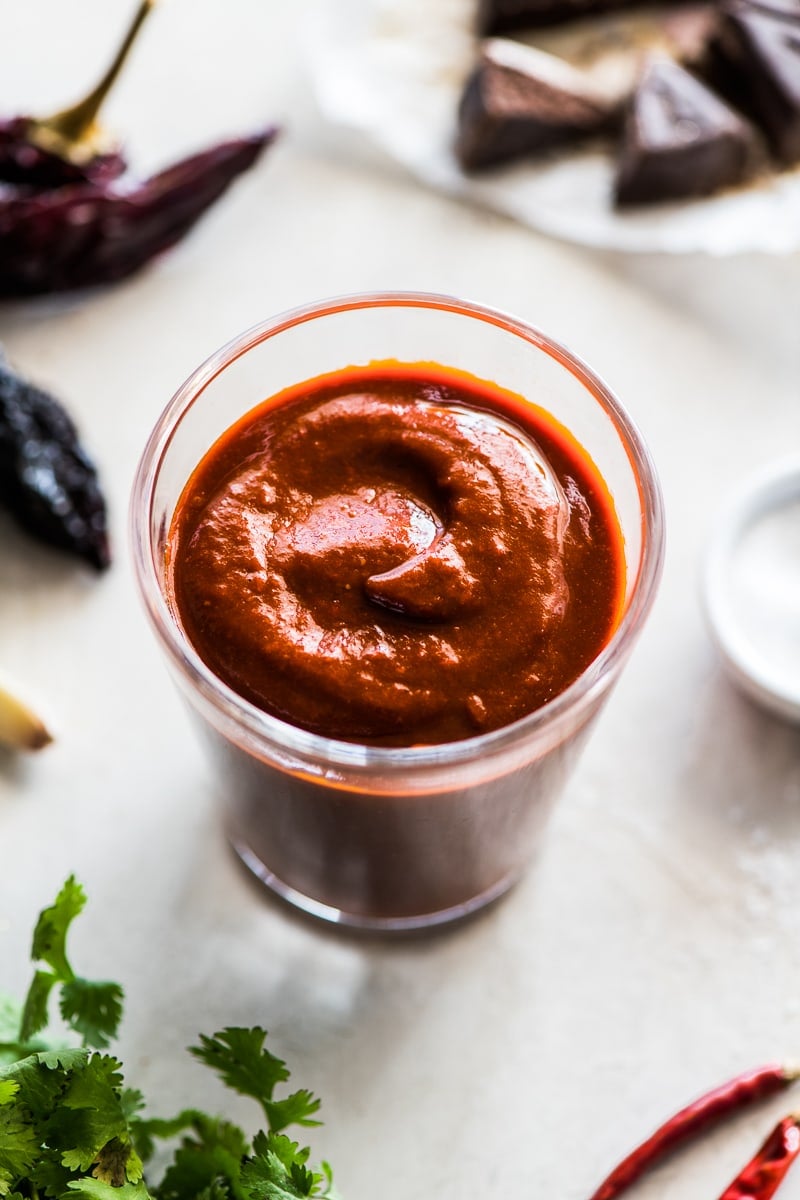 Made with dried chiles and a piece of Mexican chocolate, this Red Enchilada Sauce recipe is perfect in many dishes including enchiladas!