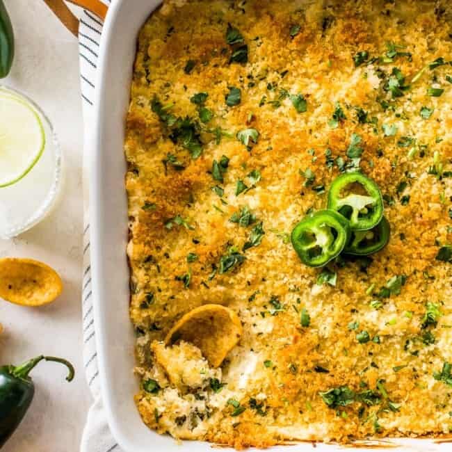 Jalapeno Popper Dip in a white square baking dish topped with crispy golden panko breadcrumbs.