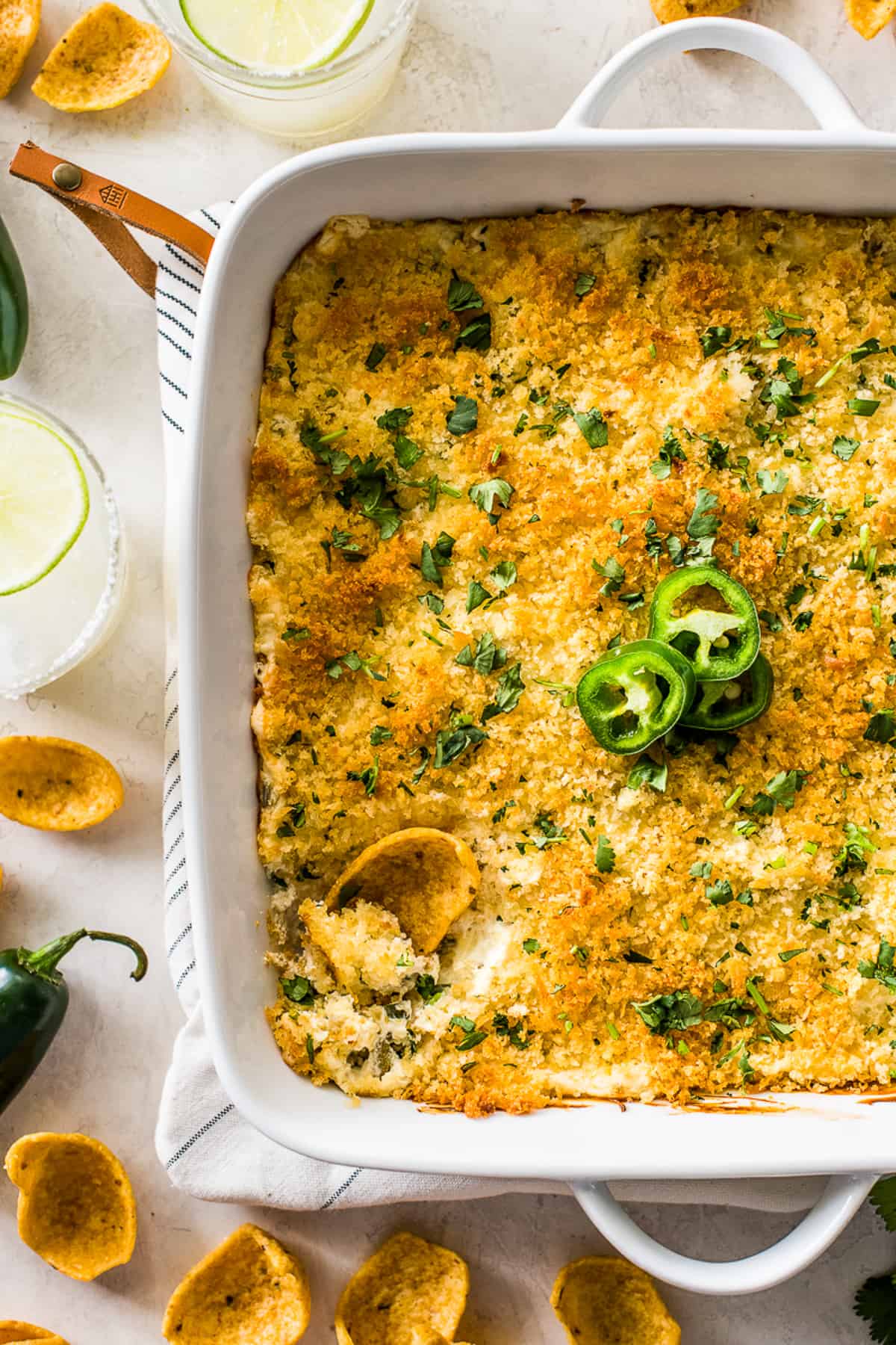 Jalapeno popper dip topped with crispy golden panko breadcrumbs and served with chips.