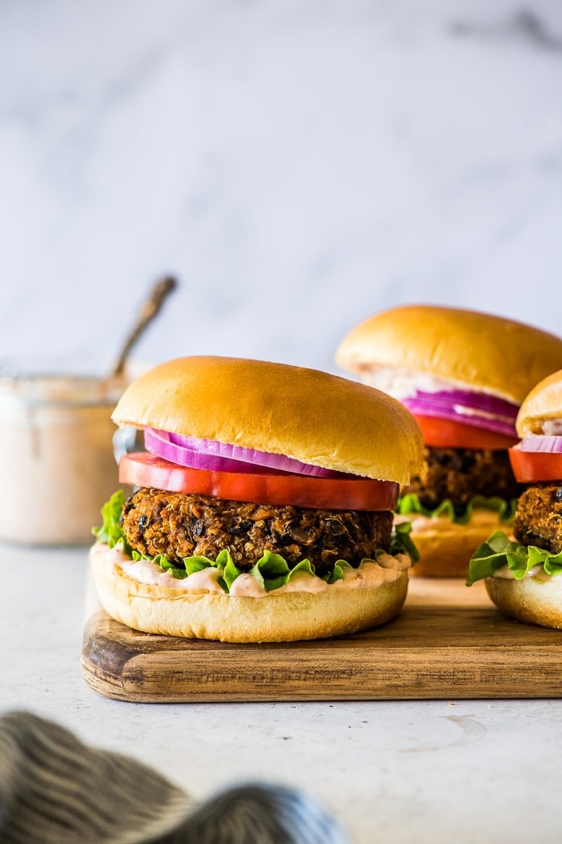 Vegan black bean burger in a biroche bun with lettuce, tomato, onion and chipotle mayo.