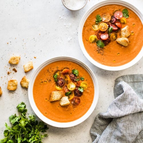 A refreshing and flavorful gazpacho recipe made from fresh sun-ripened tomatoes, cucumbers, bell peppers, onions and other simple ingredients. It's the best chilled soup you'll eat all summer! #gazpacho #summer #summerfood #soup