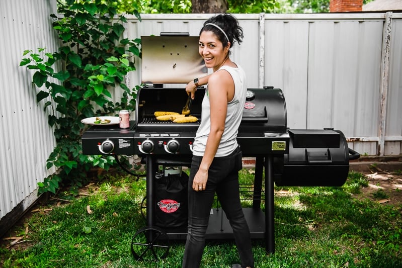 Isabel Orozco-Moore from Isabel Eats grilling on a Char-Griller grill.
