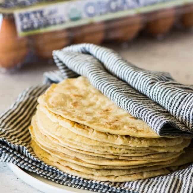 Paleo Tortillas wrapped in a clean kitchen towel.