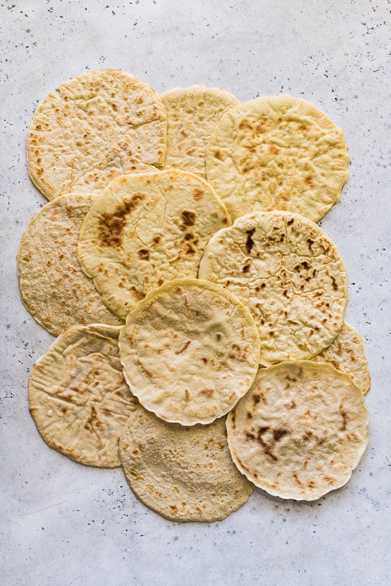 Paleo tortillas laid out a blue and white table.