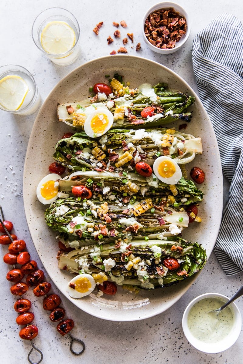 Grilled Romaine Salad on a large platter with jalapeno ranch dressing.