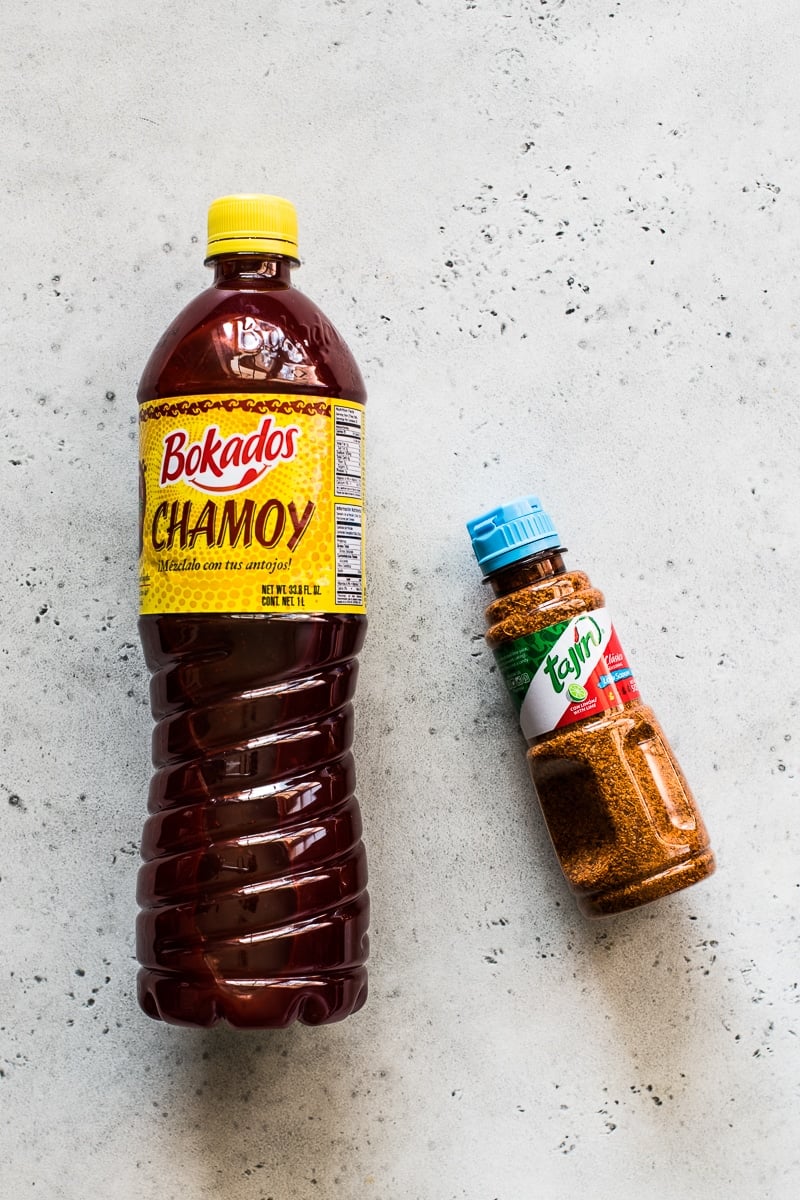 A bottle of Bokados Chamoy Sauce and Tajin chile lime seasoning