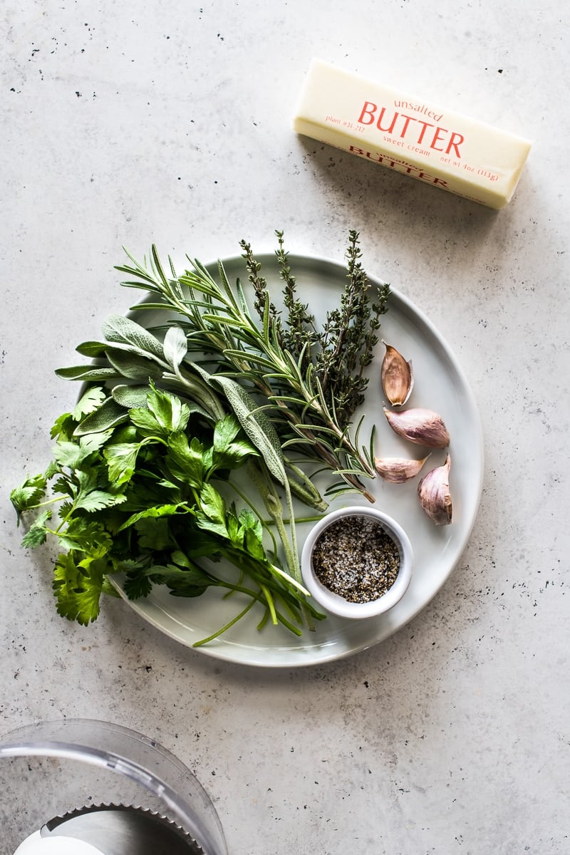 Fresh herbs, butter and garlic for an herb compound butter.