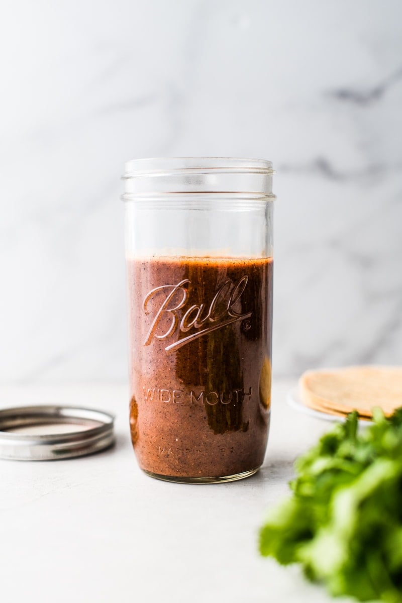 Easy Enchilada sauce in a glass jar.