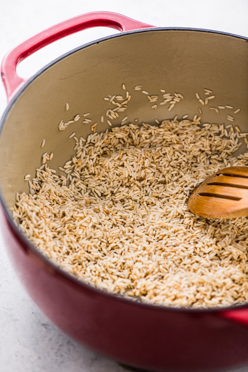 Long grain white rice in a dutch oven for making arroz verde.