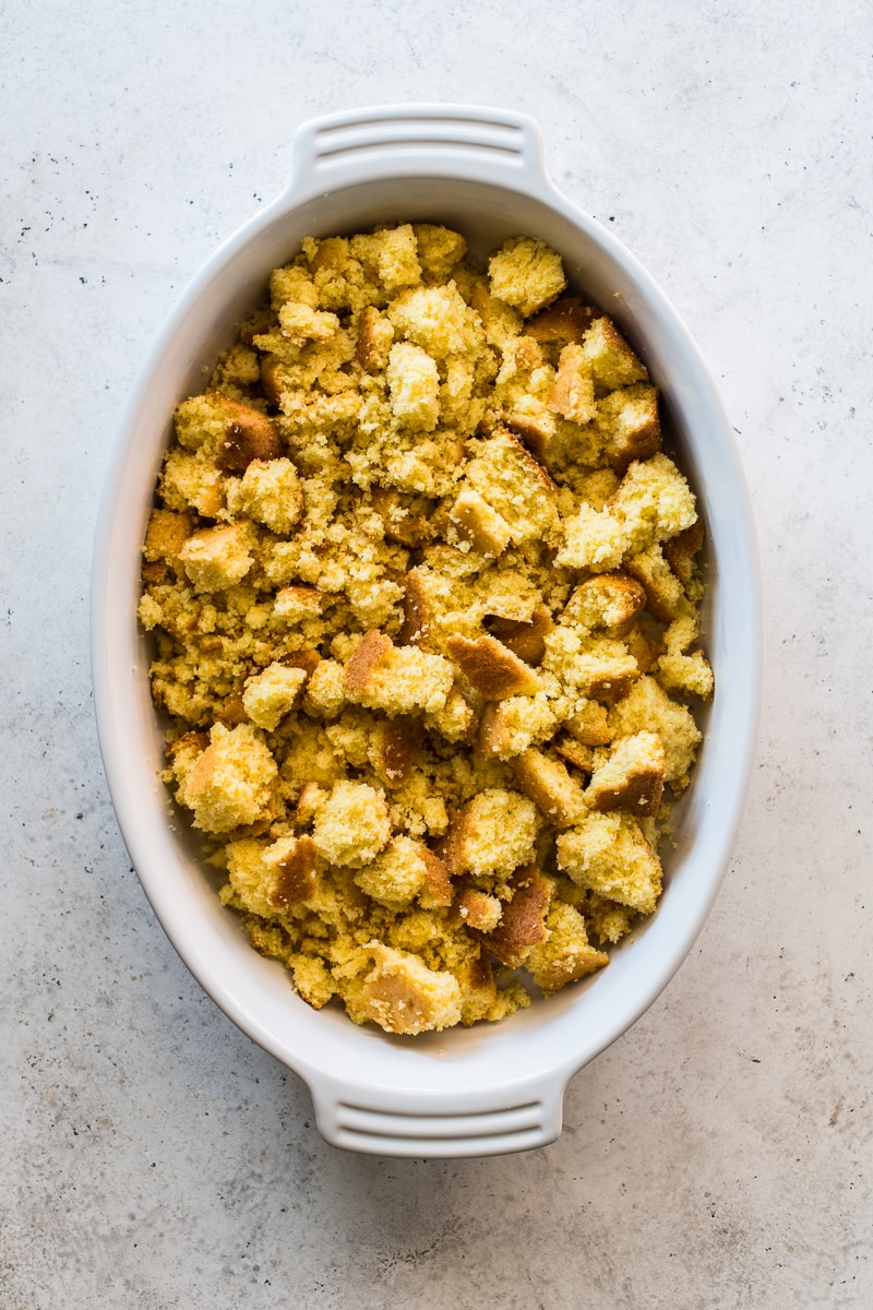 Chopped cornbread in a baking dish.