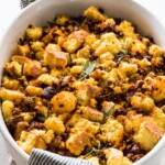 Cornbread stuffing topped with chorizo and fresh herbs.