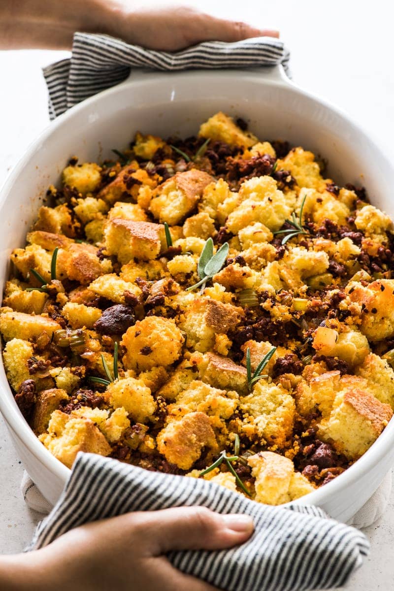 Cornbread stuffing topped with chorizo and fresh herbs.