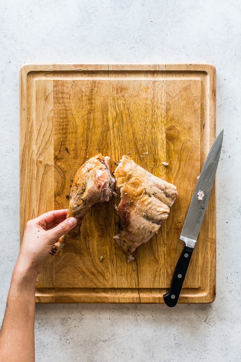 A turkey leg separated into a drumstick and thigh.