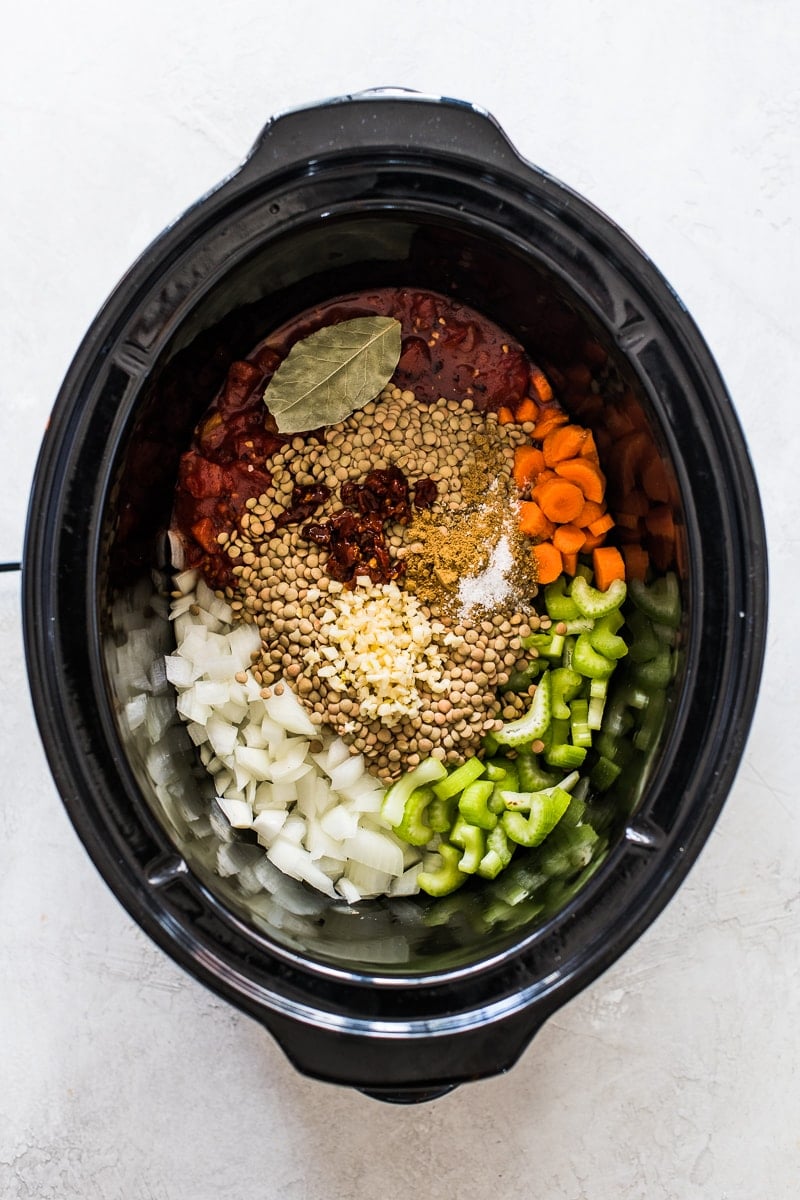 Lentil soup ingredients in a slow cooker