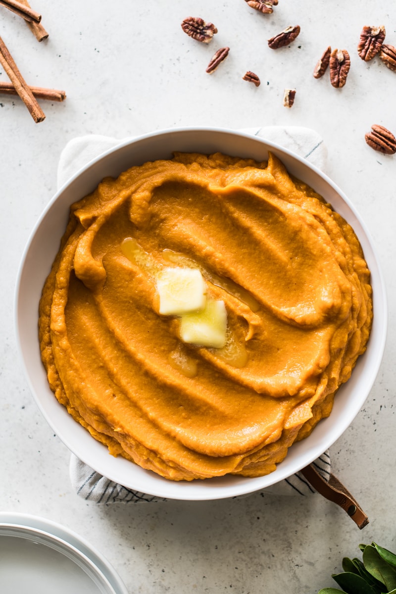 Mashed sweet potatoes in a serving bowl.