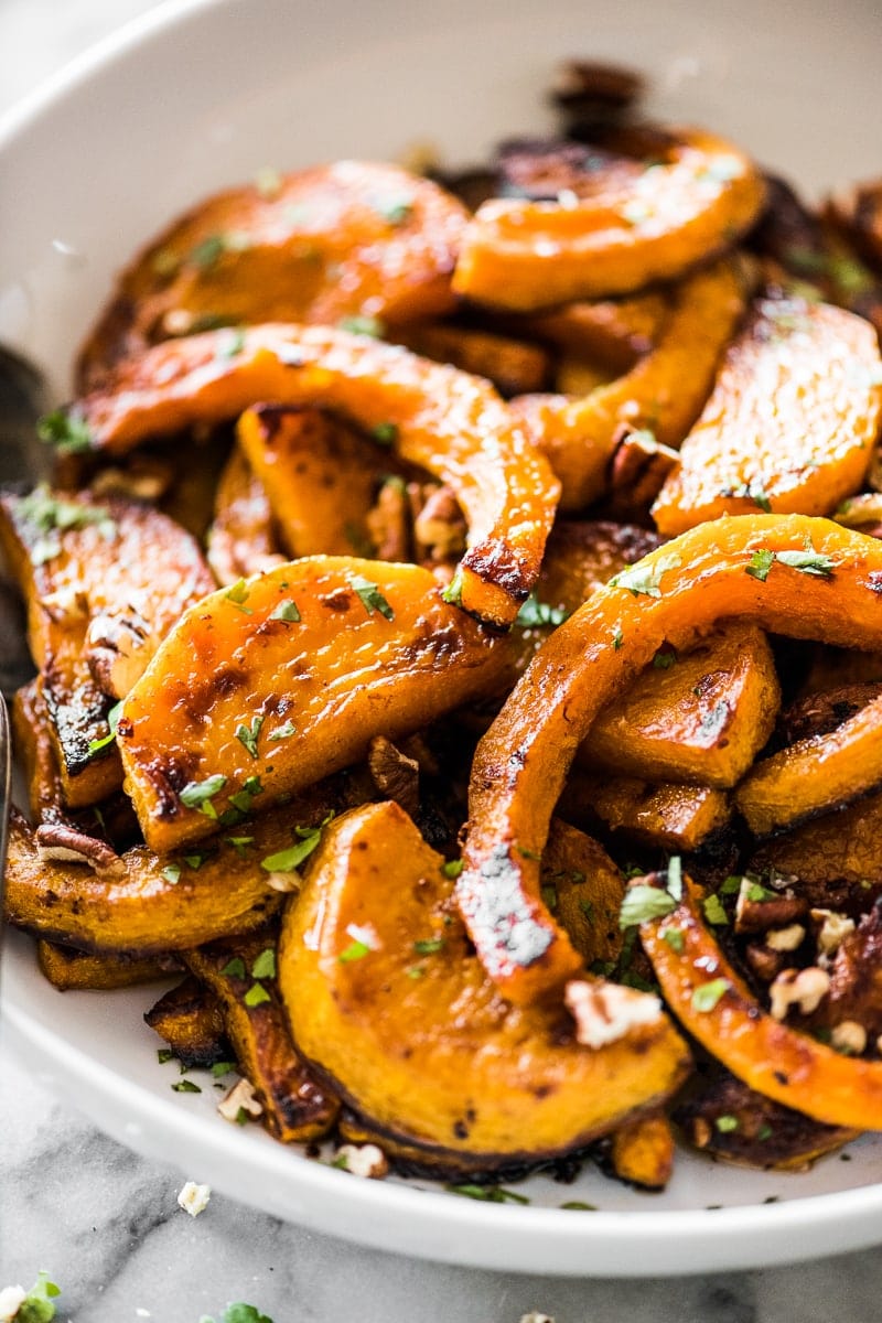 Roasted butternut squash topped with maple syrup and honey.