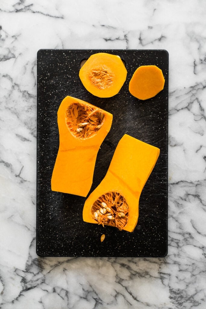 A butternut squash sliced in half lengthwise.