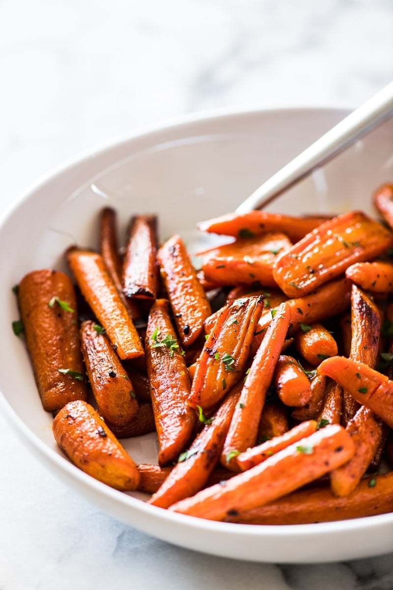 Oven roasted carrots topped with maple syrup and cinnamon