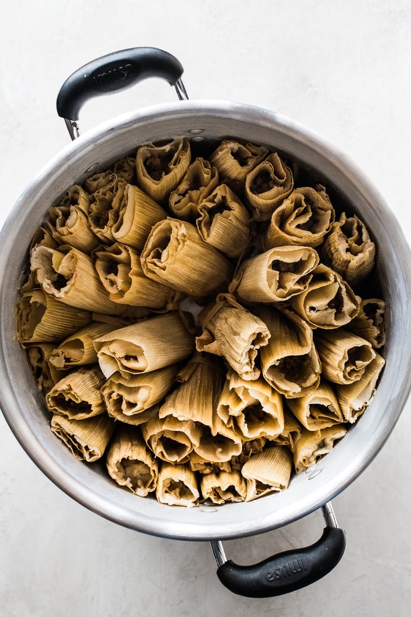 Chicken tamales in a steamer pot