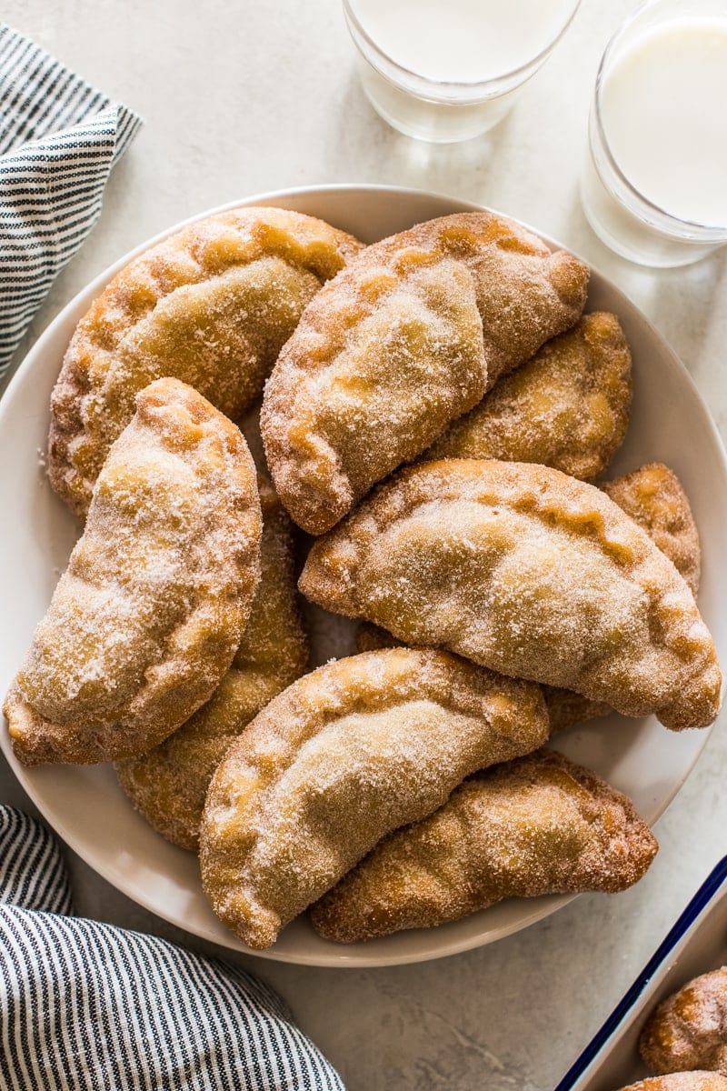 Empanadas covered with sugar in a bowl