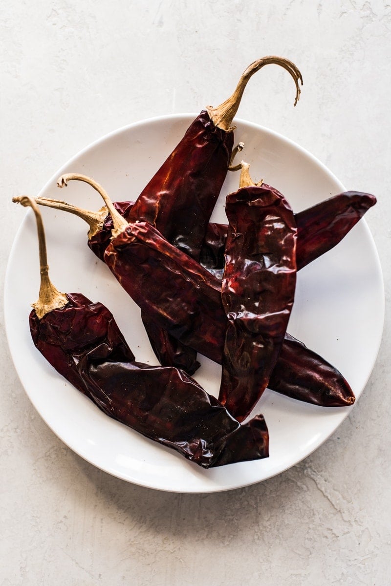 Guajillo chiles on a plate.