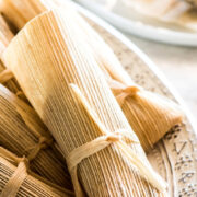 Sweet Tamales made with raisins and sweetened with cinnamon and sugar. Easy to make and perfect for holidays and celebrations! #tamales #sweettamales #vegantamales #mexicanfood