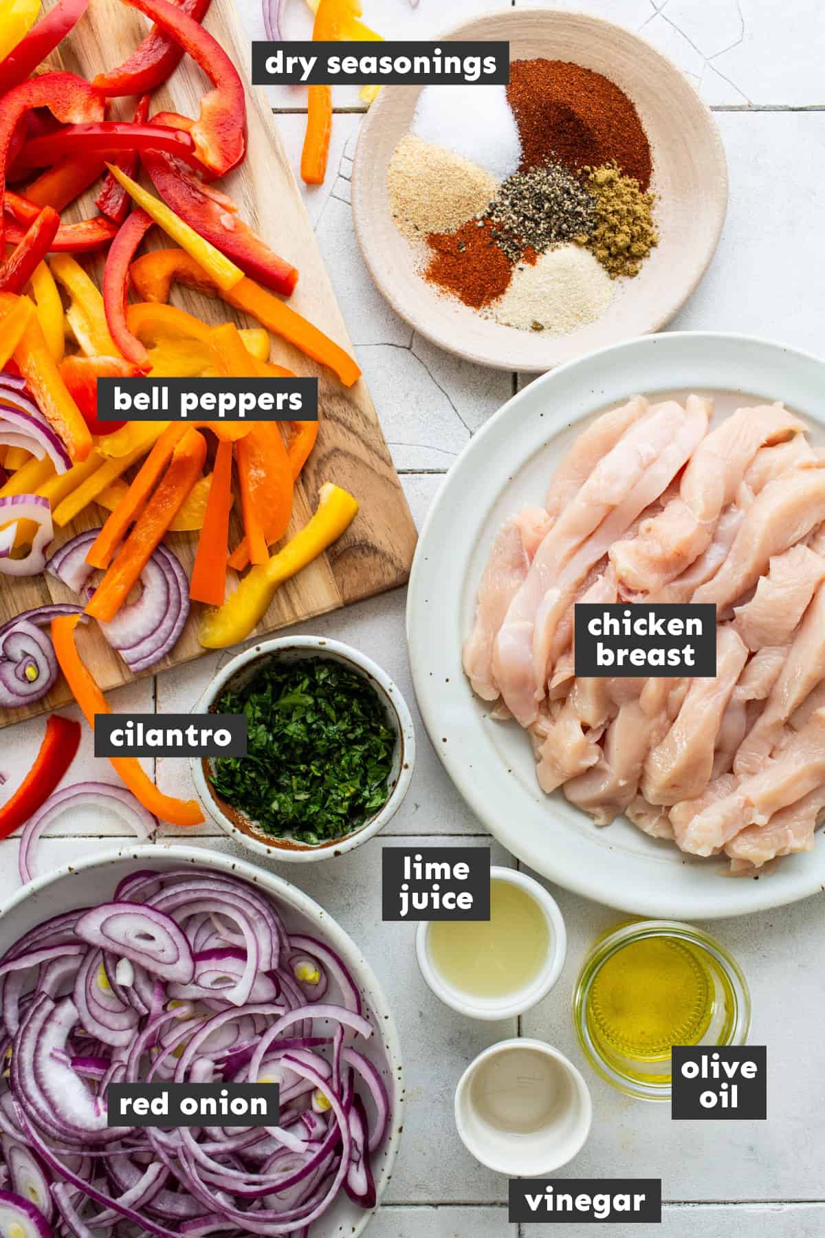 Ingredients for sheet pan chicken fajitas on a table.