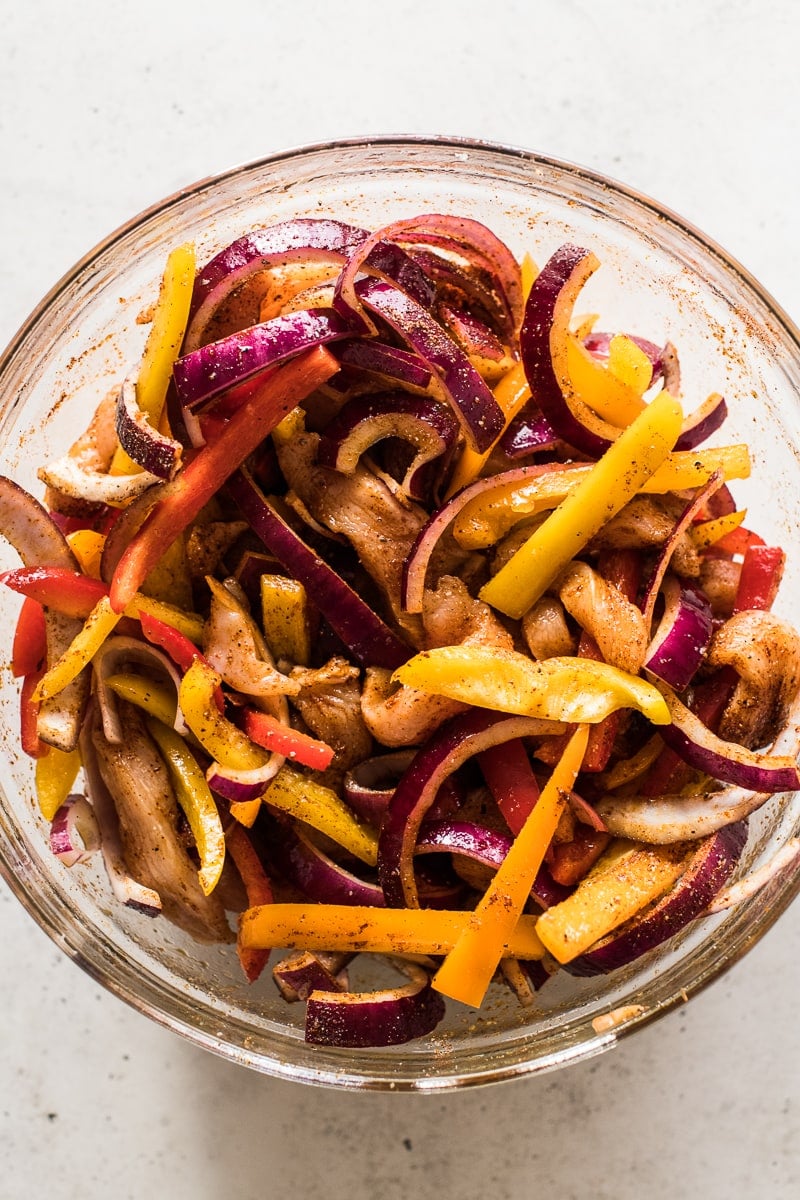 Bell peppers, onions and sliced chicken breast seasoned with fajita seasonings.