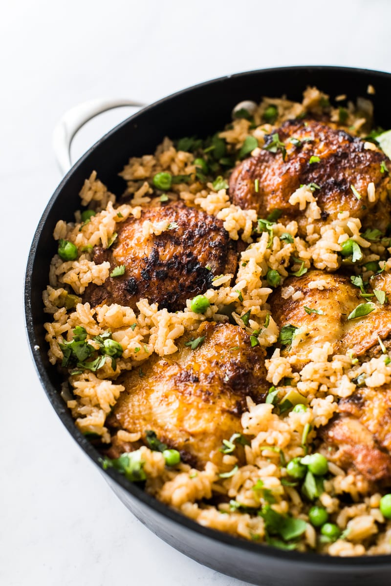 Arroz con pollo with chicken thighs and peas