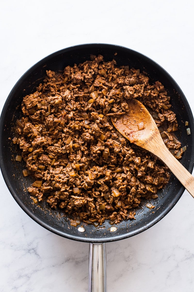 Seasoned ground beef in a skillet for hard shell tacos