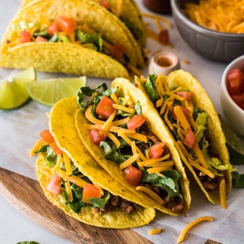 Hard shell tacos filled with ground beef and cheese.