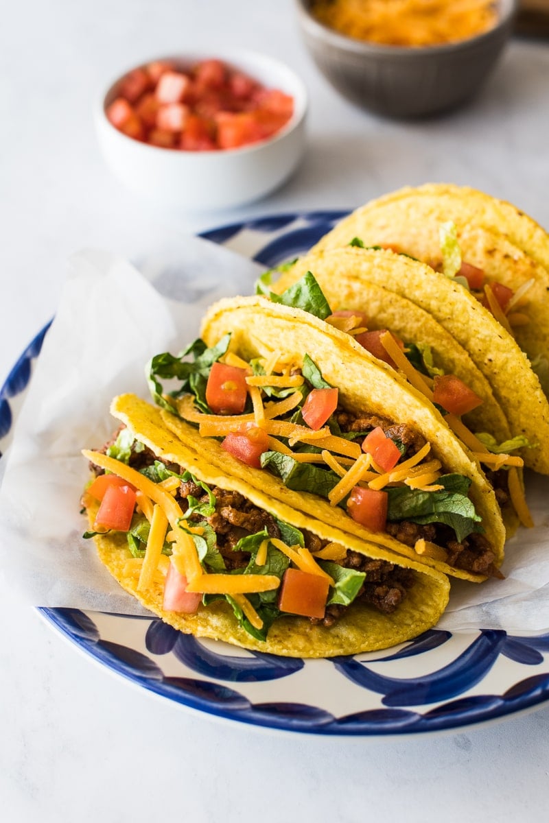 Hard shell tacos on a plate ready to be served.