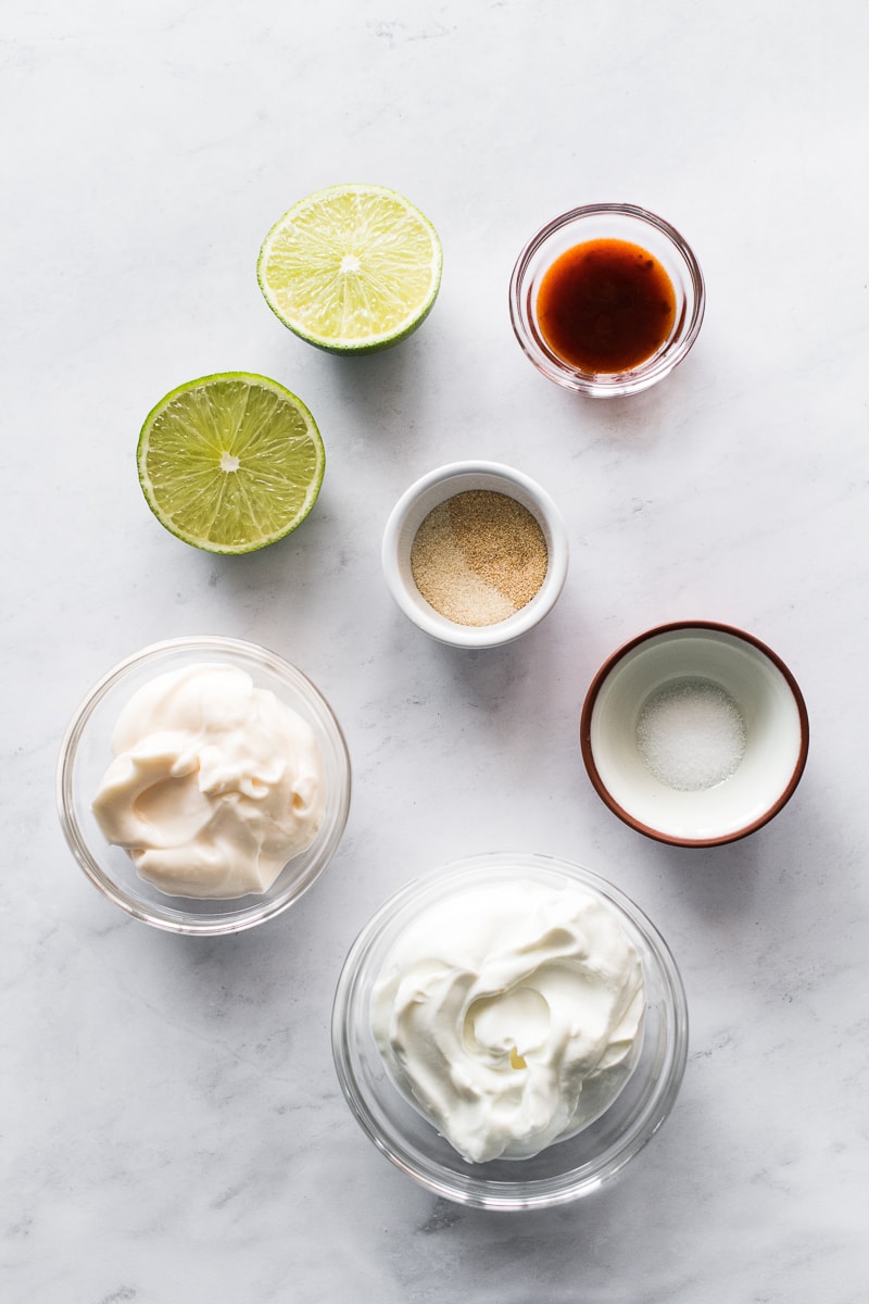 Ingredients in fish taco sauce on a table