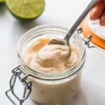 Fish taco sauce in a jar with a spoon