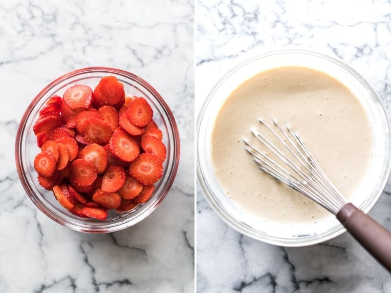 Sliced strawberries in a bowl next to a sweetened condensed milk sauce