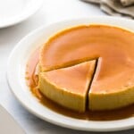 Flan on a plate with a slice cut out