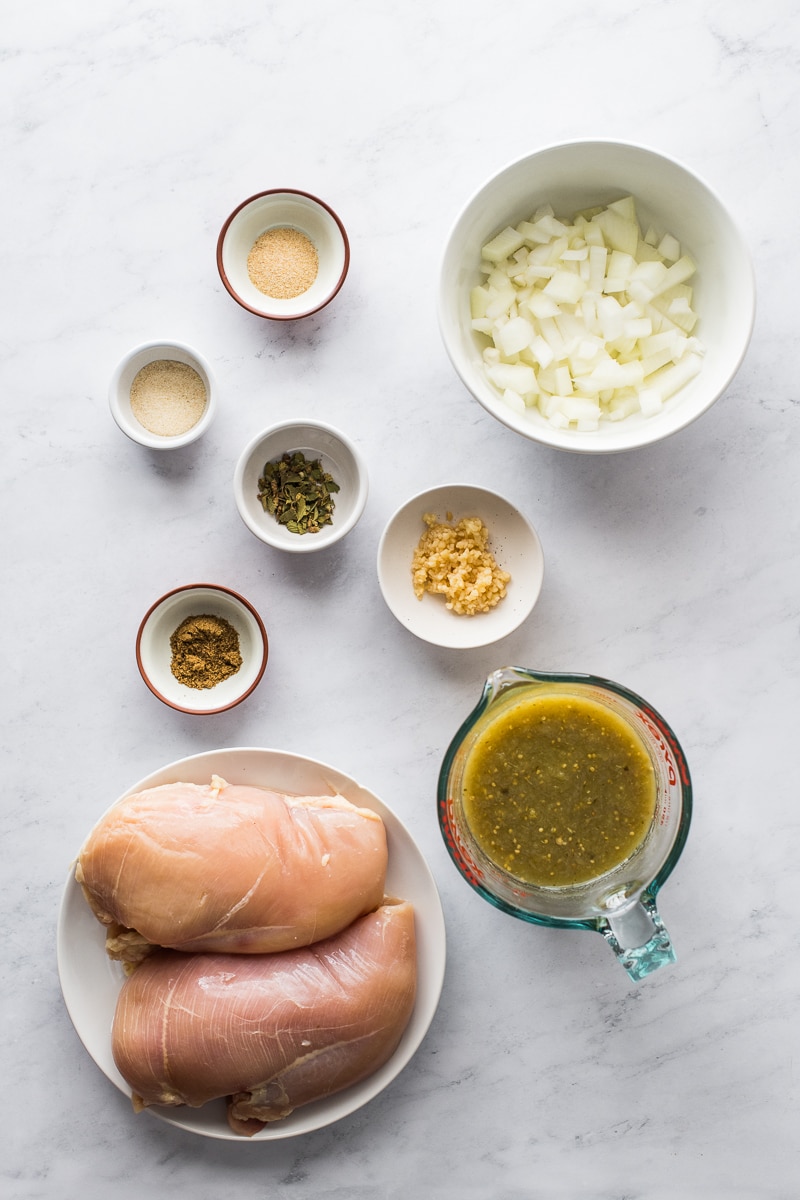 Ingredients in salsa verde chicken on a table