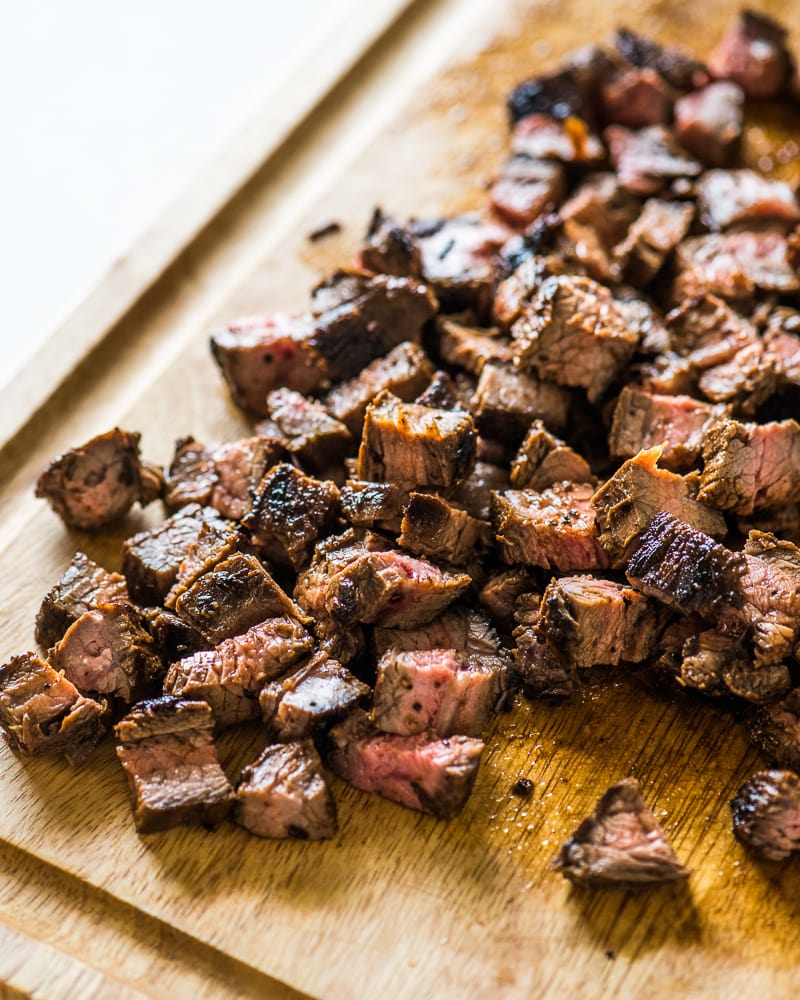 Juicy marinated carne asada on a cutting board