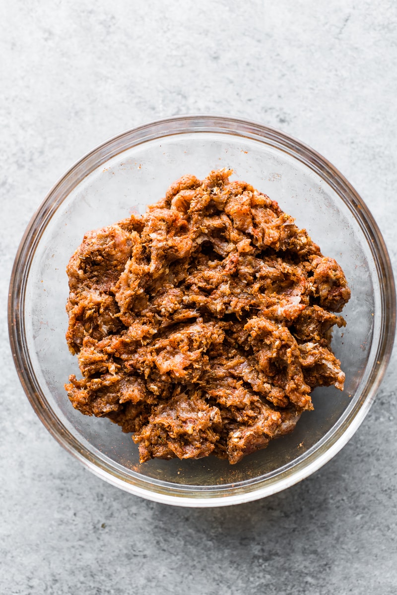 Homemade chorizo in a mixing bowl made from ground pork and spices.