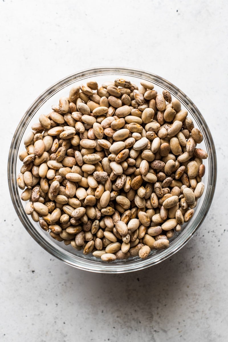 A bowl of soaked pinto beans