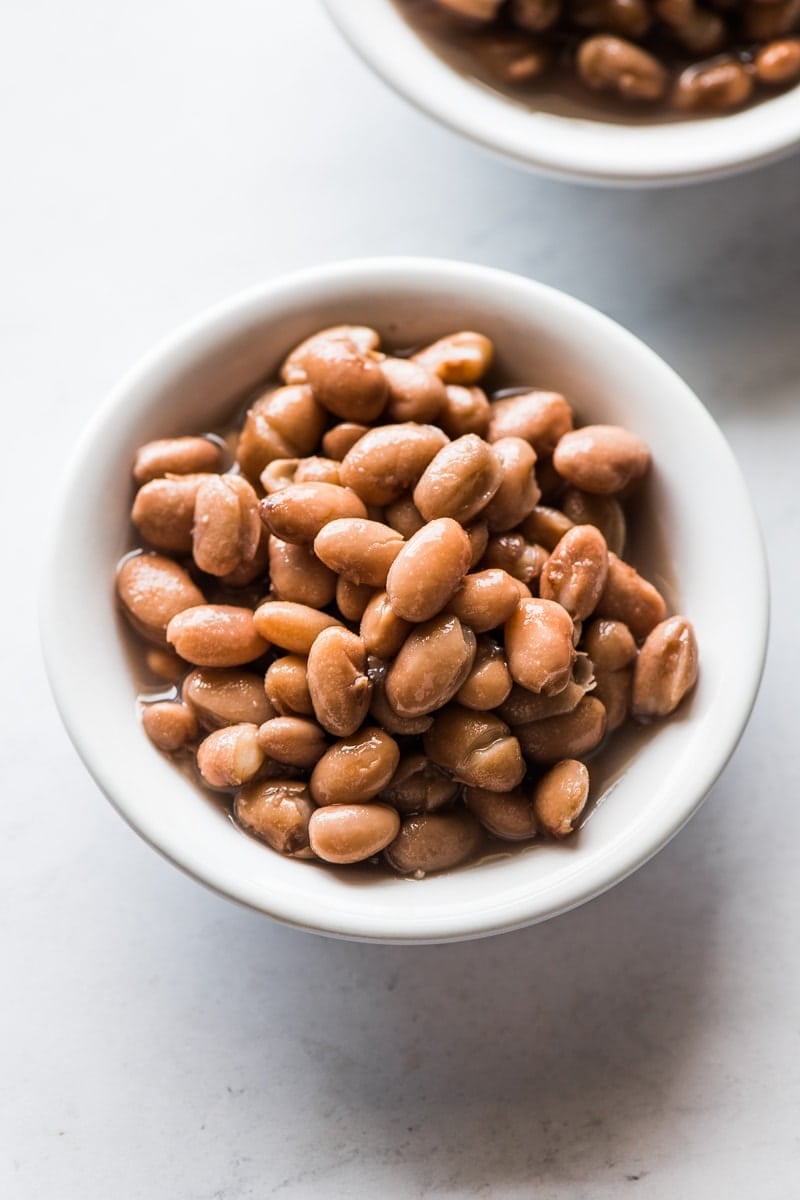 A small bowl of cooked pinto beans