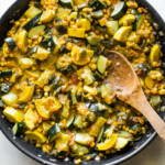 Cooked calabacitas in a large skillet.